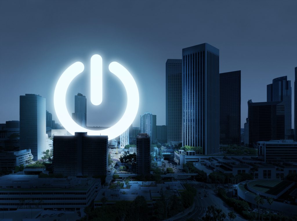 Phtoo represéntant le sigle Power dans une ville, afin de mettre en lumiere l'autoproduction d'eléctricité